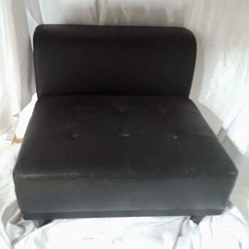 burtonesque armless sectional black leather chair rental