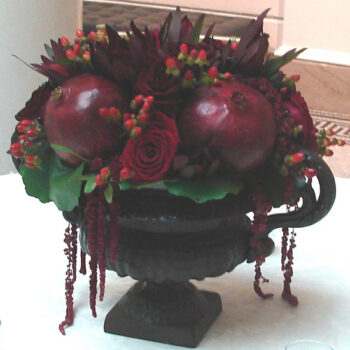 scroll handle urn cast iron vessel metal flowers rental