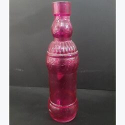colored bottle fuchia glass bottle vessel flowers rental