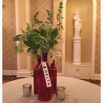 vintage bottle red clear bottle vessel flowers rental