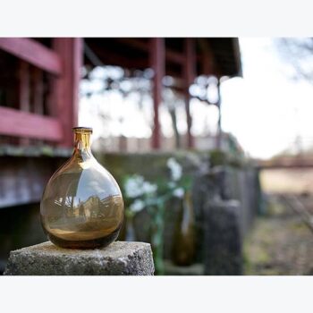 artisan bottle clear brown round vessel glass flowers rental