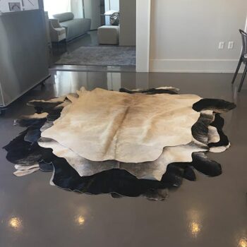 cowhide black tan white leather animal rug decor rental