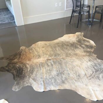 cowhide black tan white leather animal rug decor rental