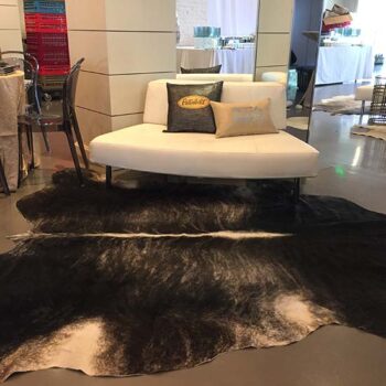 cowhide black tan white leather animal rug decor rental