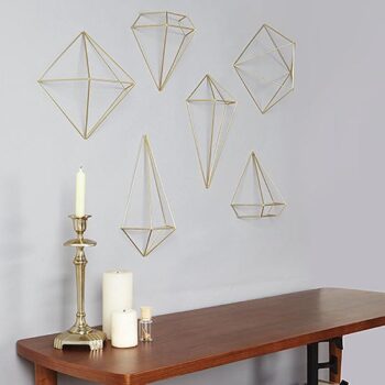 geometric frames brass gold home decor rental