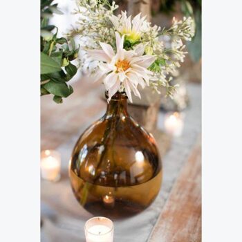 artisan bottle clear brown round vessel glass flowers rental