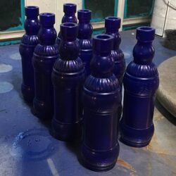 Vintage blue bottles in a 2 by 4 row